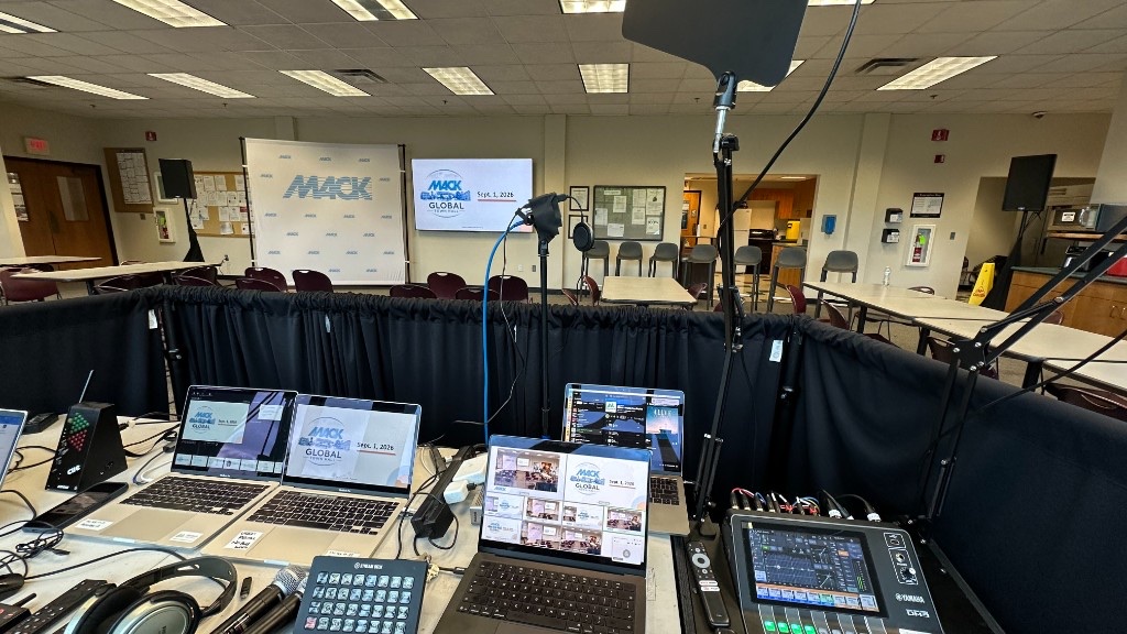 Tech table for the Mack Molding Global Town Hall, with presentation laptops, a Yamaha DM3, and the Teams program.