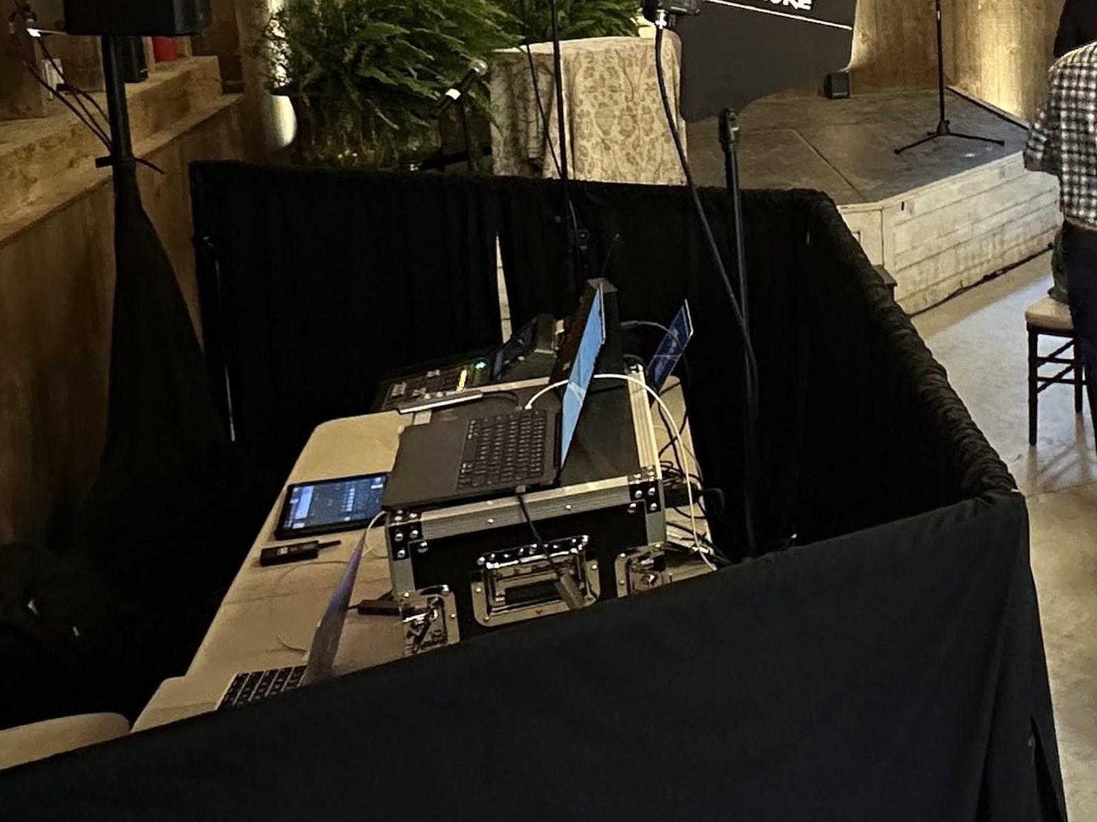 Close view of the Equinox tech table — mixer, laptops, and wireless antenna distribution at The Old Gray Barn.
